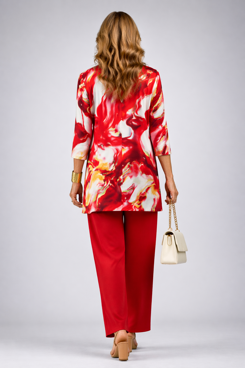 Three-piece trouser set: red trousers with patterned tunic top and matching open jacket