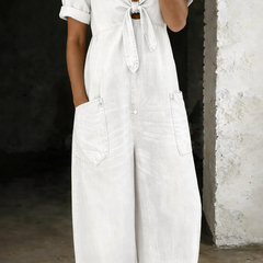 White denim V-neck short-sleeve overall with tie front and two front pockets