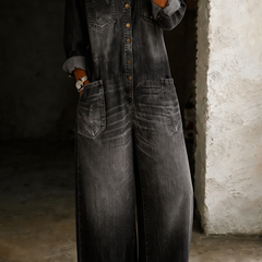 Black denim overall with button-front, chest pocket, and wide-leg fit