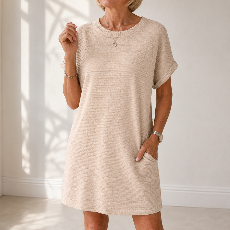 Light beige round-neck summer dress with short sleeves and side pockets, relaxed fit