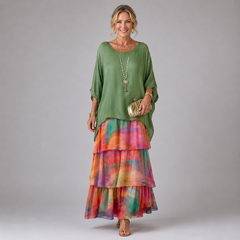 Green tiered maxi dress with multicolor plaid-style tier skirt and loose sleeves