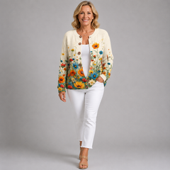 Ivory floral cardigan sweater with brown buttons and colorful flower hem detail