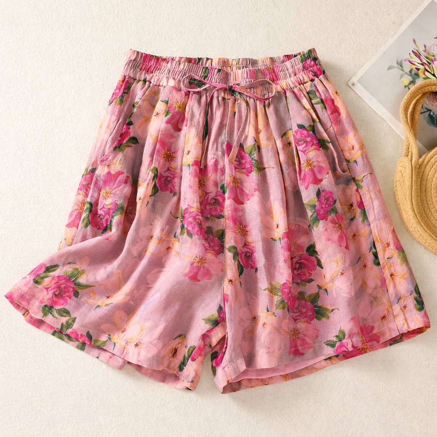 Pink floral linen shorts with elastic waist and drawstring, loose fit