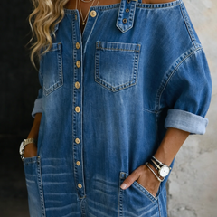 Blue off-shoulder denim overall front view with chest pocket, button placket, and wide straps