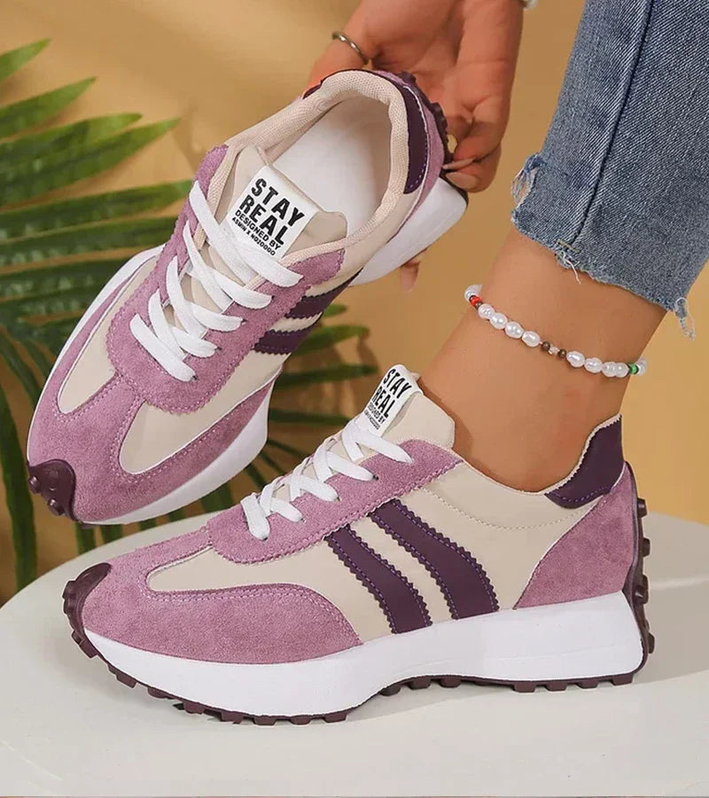 Purple and white lace-up trainers with cushioned tongue and patterned side stripes