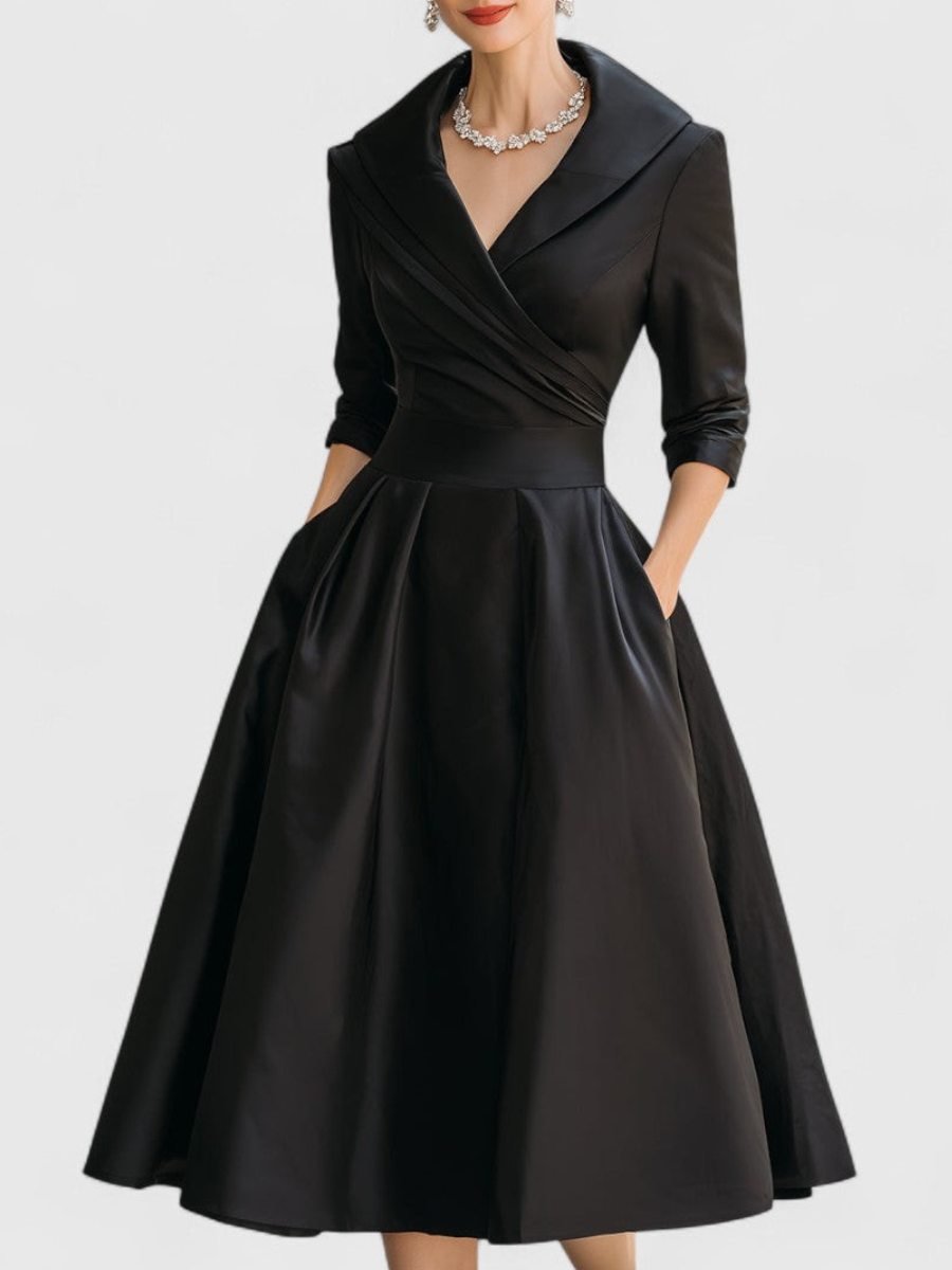 Black satin midi dress with V-neck, wrap bodice, three-quarter sleeves, gathered skirt