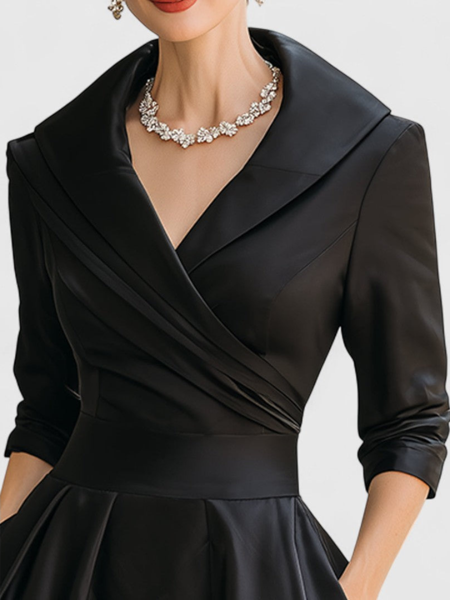 Black wrap midi dress with V-neck and draped crossover bodice, three-quarter sleeves