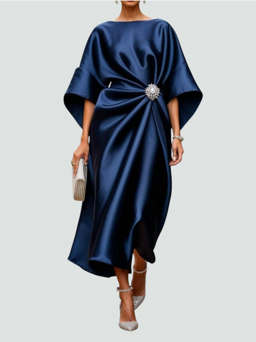 Navy satin midi dress with draped dolman sleeves and jeweled waist detail