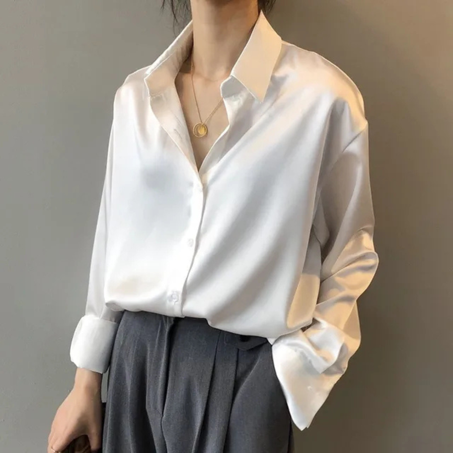 White women’s button-down blouse with pointed collar and button front