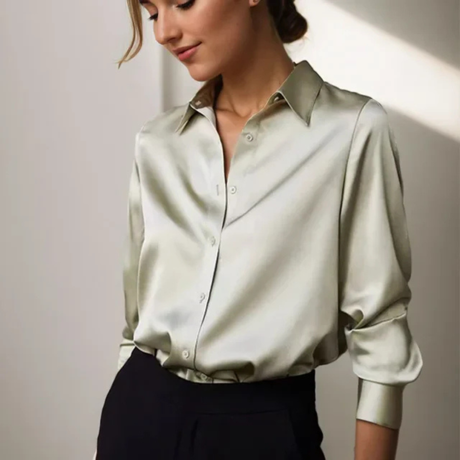 Light green women’s button-down blouse with pointed collar and long sleeves