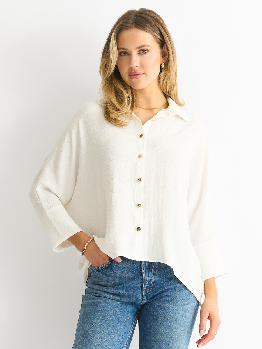 White oversized kimono blouse with point collar, button front, long sleeves