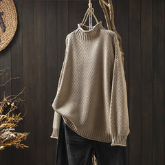 Beige waffle-knit sweater with mock neck, loose fit, ribbed cuffs and hem
