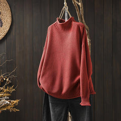 Red waffle-knit sweater with mock neck, dropped shoulders, ribbed cuffs and hem