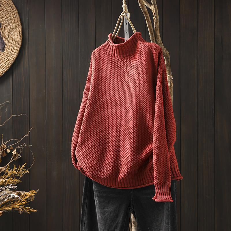 Red waffle-knit sweater with mock neck, dropped shoulders, ribbed cuffs and hem