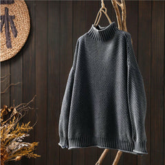 Grey waffle-knit sweater with mock neck, relaxed fit, ribbed cuffs and hem