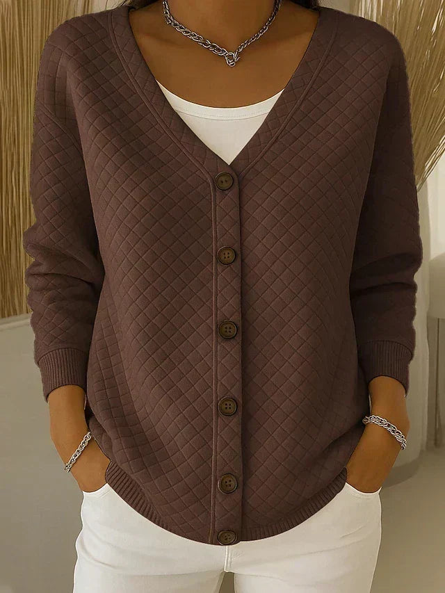 Brown quilted button-front cardigan with V-neck and long sleeves.