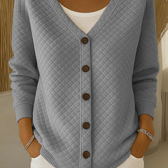 Light gray quilted button-front cardigan with V-neck and long sleeves.
