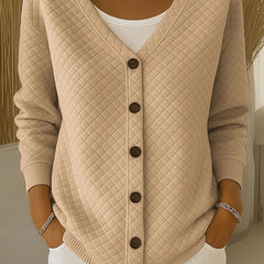 Beige quilted button-front cardigan with V-neck and long sleeves.