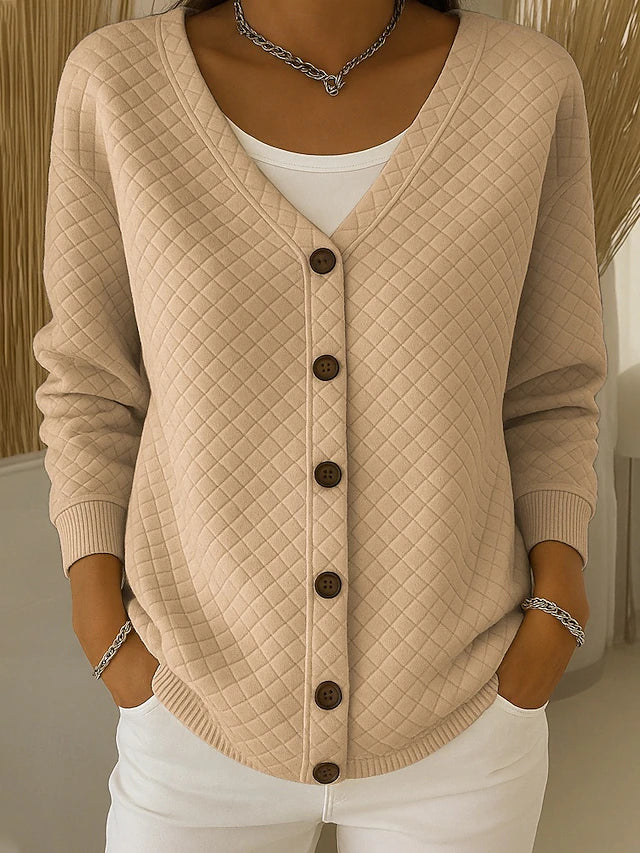 Beige quilted button-front cardigan with V-neck and long sleeves.