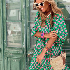 Boho maxi dress in green with pink dot pattern, V-neck and long sleeves with gathers