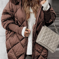 Brown quilted winter jacket with faux fur trimmed hood, zip front, ribbed cuffs