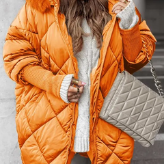 Orange quilted winter jacket with faux fur trimmed hood, zip front, ribbed knit cuffs