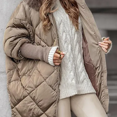 Khaki quilted winter jacket with faux fur hood, zip front, ribbed knit cuffs, side view