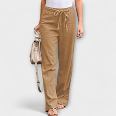 Wide-leg trousers with tie belt, light brown fabric with elastic waist and loose straight legs