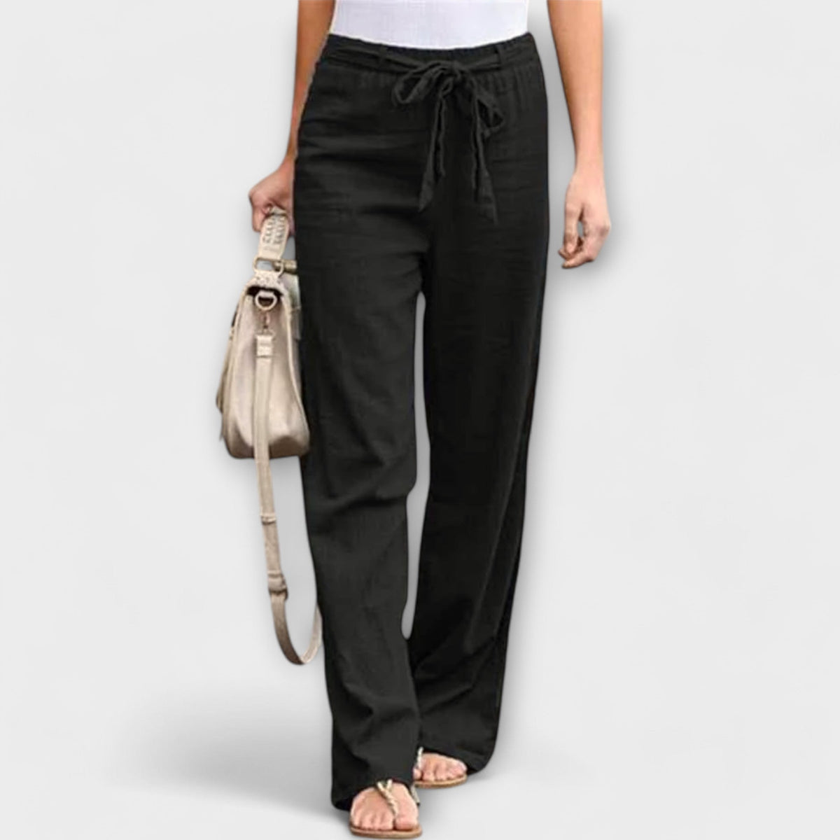 Wide-leg trousers with tie belt, black fabric with elastic waist and wide, flowing leg shape