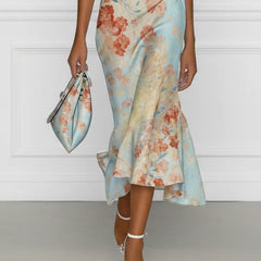 Off-shoulder midi mermaid dress in blue floral print, sleeveless with flared midi hem