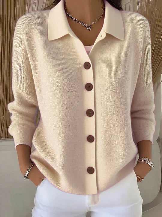 Cream button-front collared cardigan sweater with long sleeves, button placket
