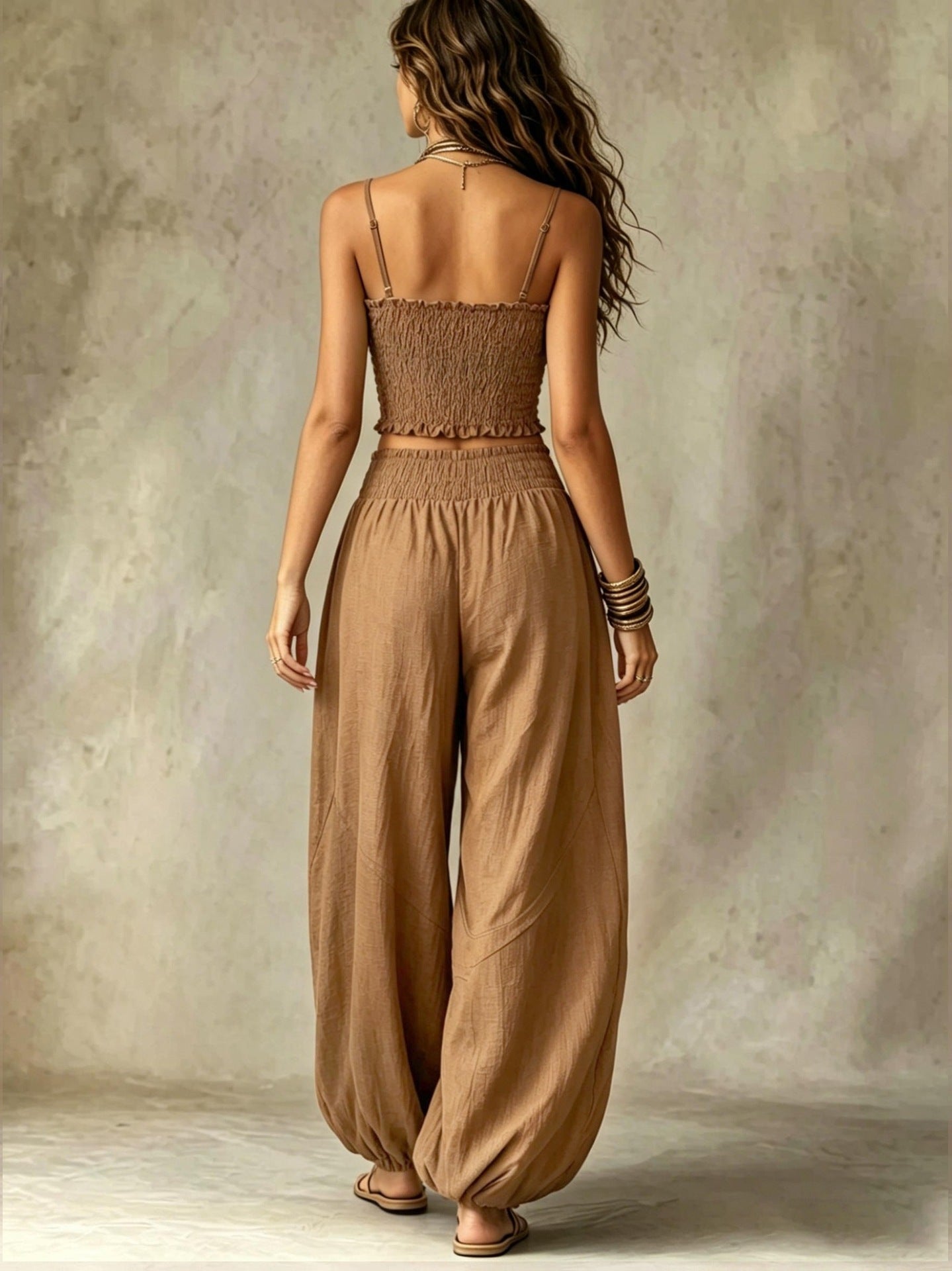 Smocked crop top and wide-leg pants set in khaki, open back with thin straps and gathers.