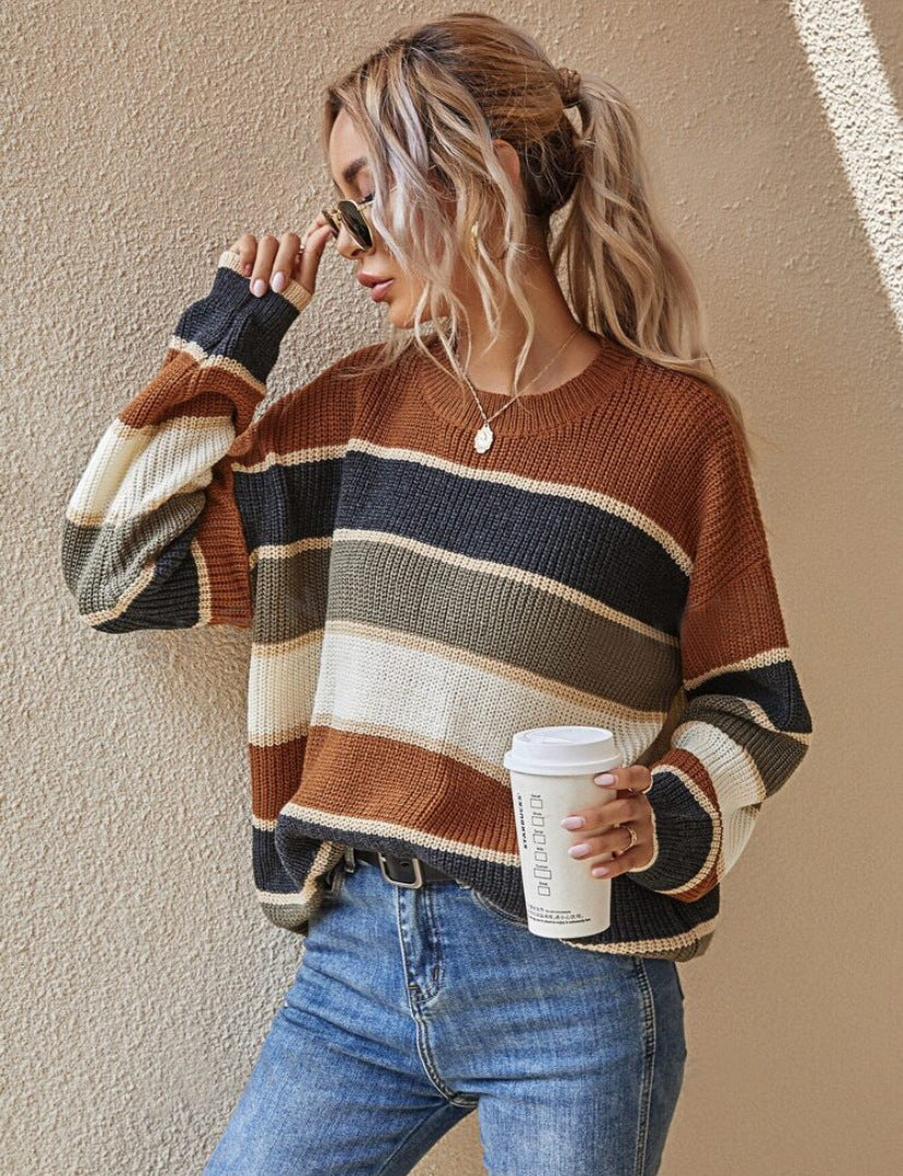 Striped long-sleeve round-neck sweater in rust brown, dark navy, and cream