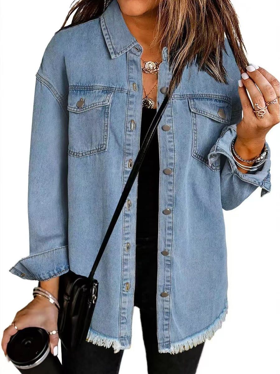 Light blue denim jacket with button front, chest pockets, and frayed hem.
