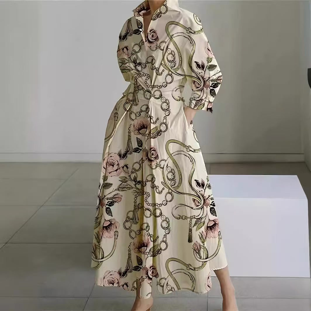 Cream maxi wrap collared dress with ornate chain and floral print, three-quarter sleeves