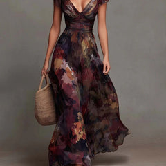 V-neck pleated maxi dress with watercolor floral print and fluttery layered skirt