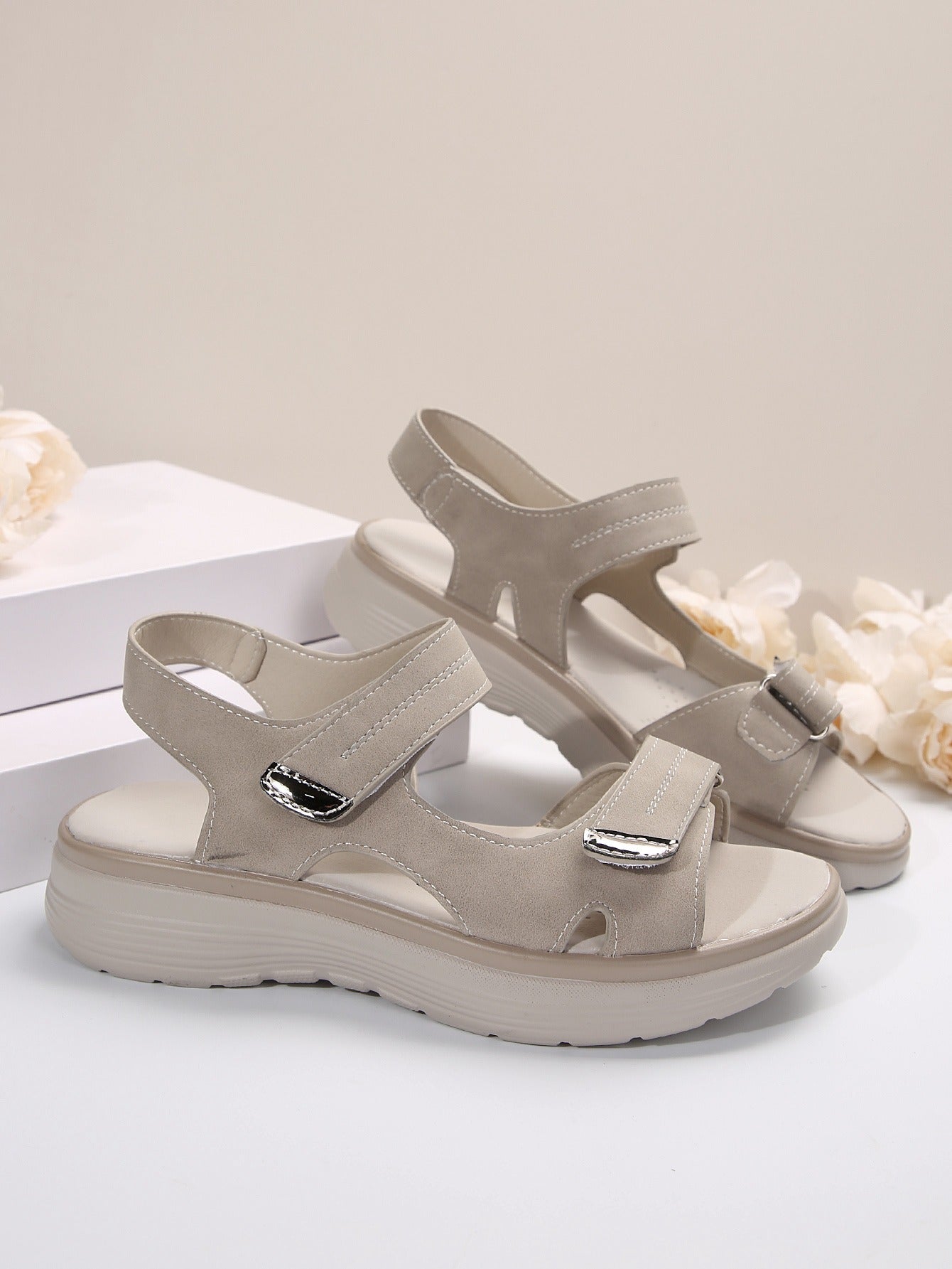 Beige supportive orthopaedic sandals with two hook-and-loop straps and padded footbed
