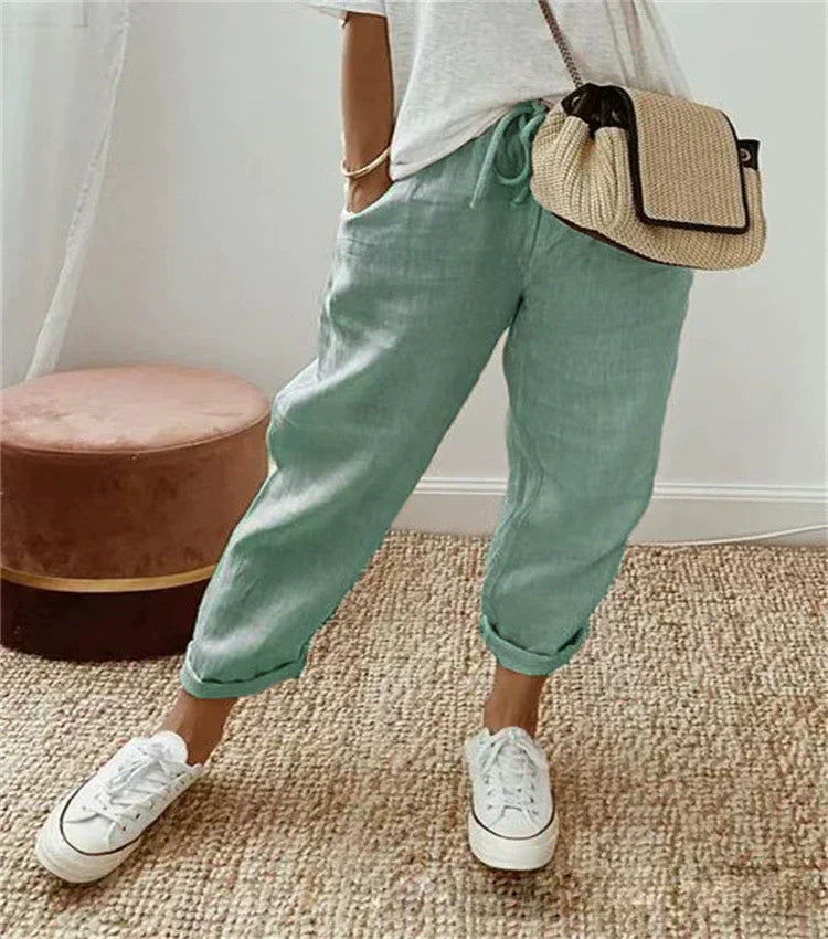 Light green breathable casual trousers with relaxed tapered legs and ankle cuffs