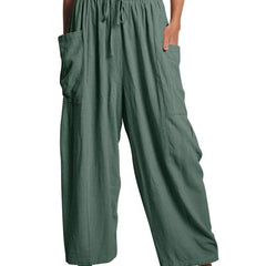 Green wide-leg trousers with elastic waist and drawstring, side cargo pockets.