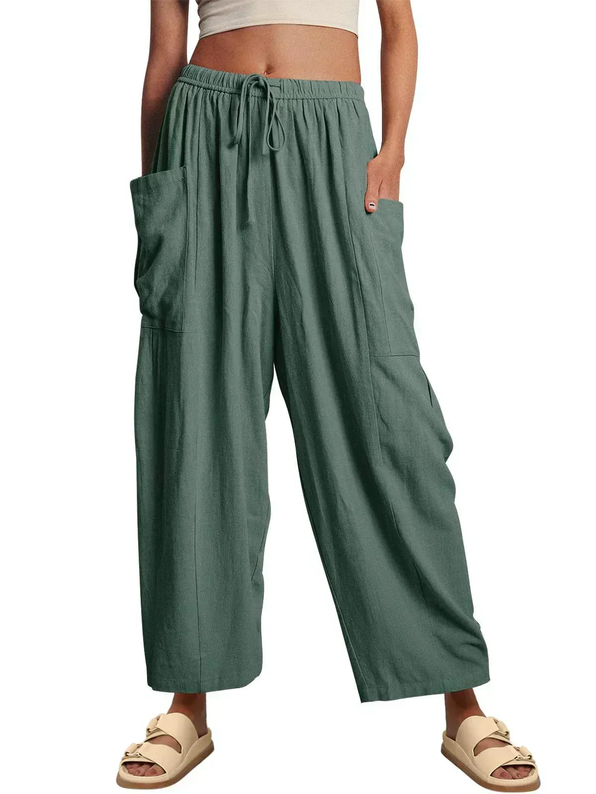 Green wide-leg trousers with elastic waist and drawstring, side cargo pockets.