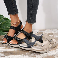 Supportive orthopaedic sandals in black and beige with hook-and-loop closures