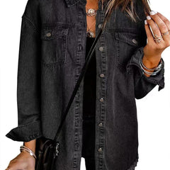 Black denim jacket with button front, chest pockets, and frayed hem.