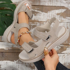 Light beige supportive orthopaedic sandals with two hook-and-loop straps and molded sole