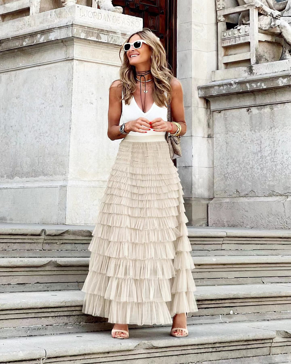 Cream maxi layered cake skirt with tiered ruffle layers and gathered waistline