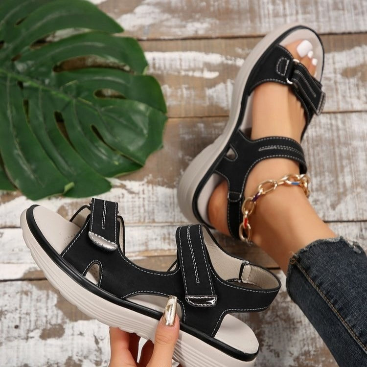 Black supportive orthopaedic sandals with two hook-and-loop straps and cushioned sole