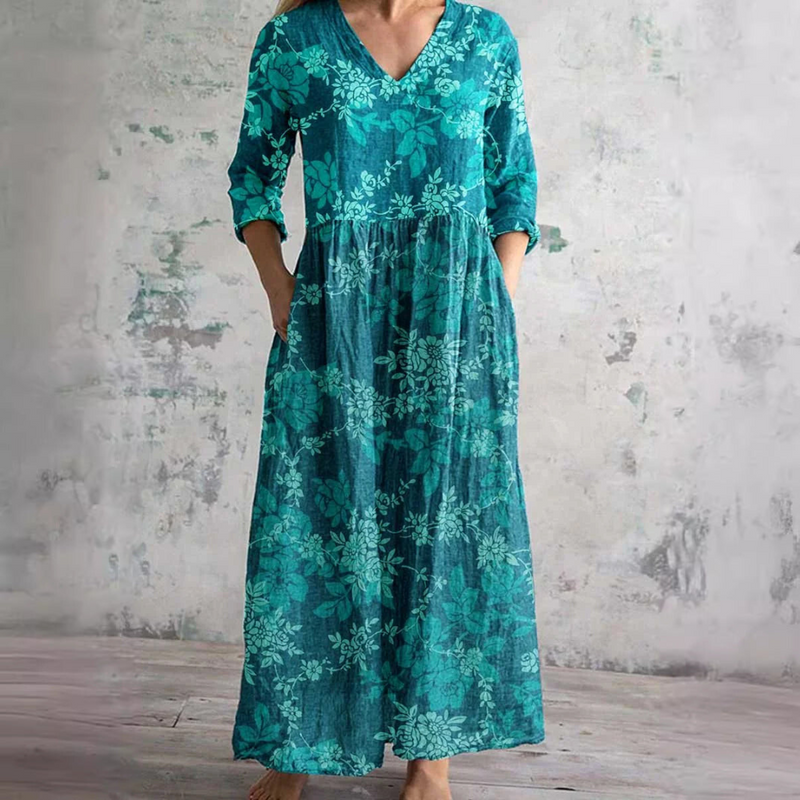 Floral summer dress in teal with V-neck, gathered waist, long sleeves