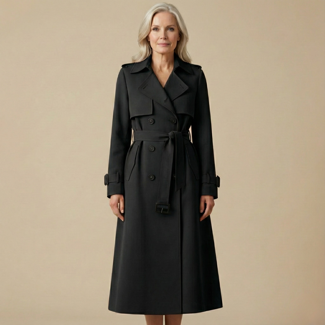 Black belted trench coat with wide lapels, flap pockets, and shoulder cuff straps