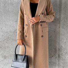 Tan longline double-breasted coat with notched lapels and flap pockets