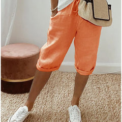 Lightweight summer shorts in apricot orange, cuffed hem and elastic waist