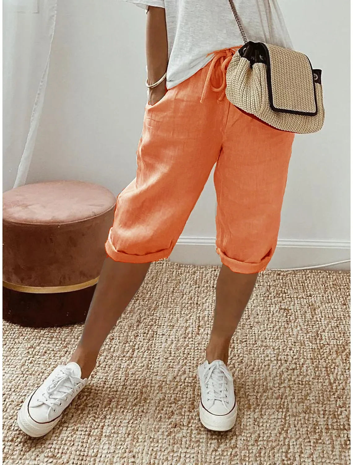 Lightweight summer shorts in apricot orange, cuffed hem and elastic waist